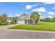 Charming single-story home with a well-manicured lawn, welcoming porch, and attached two-car garage at 3600 White Wing Circle, Myrtle Beach, SC 29579