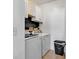 Functional laundry room with white cabinetry, wood shelving, and modern washer and dryer units at 3600 White Wing Circle, Myrtle Beach, SC 29579