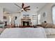Inviting living room featuring a cozy fireplace, ceiling fan, and comfortable seating arrangement at 3600 White Wing Circle, Myrtle Beach, SC 29579