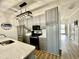 Modern kitchen features stainless steel appliances, light gray cabinetry, and quartz countertops at 4519 N Plantation Harbour Dr. # X - 19, Little River, SC 29566