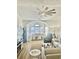 Bright living room with large windows, comfortable seating, and a modern rug at 4519 N Plantation Harbour Dr. # X - 19, Little River, SC 29566