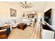 Bright open-concept living room offering hardwood floors and a large flat screen television at 4519 N Plantation Harbour Dr. # X - 19, Little River, SC 29566