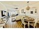Bright living room with hardwood floors, dining table, and lots of natural light at 4519 N Plantation Harbour Dr. # X - 19, Little River, SC 29566