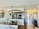 Open-concept living and kitchen with stainless steel appliances and chandelier at 4519 N Plantation Harbour Dr. # X - 19, Little River, SC 29566