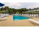 Inviting community pool surrounded by lounge chairs and lush landscaping at 4519 N Plantation Harbour Dr. # X - 19, Little River, SC 29566