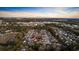 Aerial view shows home nestled in established neighborhood, surrounded by trees, near commercial amenities at 453 Saint Charles Circle, Myrtle Beach, SC 29588