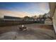 Spacious backyard features a fire pit on a large patio, perfect for entertaining and relaxation at 453 Saint Charles Circle, Myrtle Beach, SC 29588