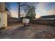 Backyard features firepit, storage shed, patio and wooden fence creating a private outdoor living space at 453 Saint Charles Circle, Myrtle Beach, SC 29588