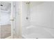 Bathroom features a shower-tub combination and a view to an adjacent bedroom at 453 Saint Charles Circle, Myrtle Beach, SC 29588