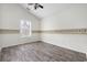 Bedroom featuring a ceiling fan, wood floors, palm tree border, and a window at 453 Saint Charles Circle, Myrtle Beach, SC 29588