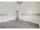 Bedroom with wood flooring, vaulted ceiling, ceiling fan, and access to closet and other rooms at 453 Saint Charles Circle, Myrtle Beach, SC 29588