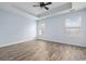 Spacious bedroom features a trey ceiling with fan, two windows and laminate wood flooring at 453 Saint Charles Circle, Myrtle Beach, SC 29588