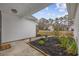 Cozy front porch area, decorated with an American flag and featuring charming landscaping at 453 Saint Charles Circle, Myrtle Beach, SC 29588