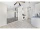 Bright kitchen area with tile flooring, white cabinetry and appliances is open to the living area at 453 Saint Charles Circle, Myrtle Beach, SC 29588