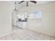 Bright kitchen features tile floors, white cabinetry, and a window overlooking the backyard at 453 Saint Charles Circle, Myrtle Beach, SC 29588