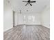 Bright and airy living room featuring vaulted ceilings, wood-look flooring, and an open layout at 453 Saint Charles Circle, Myrtle Beach, SC 29588