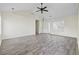 Inviting living room with vaulted ceilings, wood-look flooring, and ample natural light at 453 Saint Charles Circle, Myrtle Beach, SC 29588