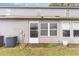 Back exterior of home with door, windows, and patio at 4584 Lomax Ct. # 1B, Murrells Inlet, SC 29576