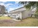 Back of home featuring a patio area, lawn, and exterior finishes that create a comfortable outdoor space at 4584 Lomax Ct. # 1B, Murrells Inlet, SC 29576