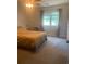 Bedroom features a large window and neutral carpeting at 4584 Lomax Ct. # 1B, Murrells Inlet, SC 29576