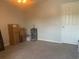 Bedroom with carpet, a ceiling fan, a door, and some boxes for storage at 4584 Lomax Ct. # 1B, Murrells Inlet, SC 29576