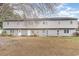 A charming two-story townhome with a well-maintained lawn at 4584 Lomax Ct. # 1B, Murrells Inlet, SC 29576