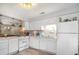 Bright kitchen featuring white cabinets, modern appliances, and plenty of counter space at 4584 Lomax Ct. # 1B, Murrells Inlet, SC 29576