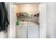 Bright laundry room with washer, dryer and shelving at 4584 Lomax Ct. # 1B, Murrells Inlet, SC 29576