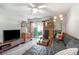 A cozy living room with stylish furnishings and a sliding glass door at 4584 Lomax Ct. # 1B, Murrells Inlet, SC 29576