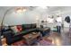 Open-concept living room featuring a large sofa and seamless access to the kitchen at 4584 Lomax Ct. # 1B, Murrells Inlet, SC 29576