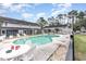 Community pool area with lounge chairs, tables, and well-maintained landscaping for residents' enjoyment at 4584 Lomax Ct. # 1B, Murrells Inlet, SC 29576
