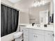 Full bathroom with tub shower combo and white vanity at 4936 Crab Pond Ct. # 201, Myrtle Beach, SC 29579