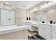 Bright bathroom featuring dual sinks, granite countertops, and a walk-in shower at 4936 Crab Pond Ct. # 201, Myrtle Beach, SC 29579
