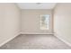 Well-lit bedroom featuring neutral walls, carpeted flooring, and a window at 4936 Crab Pond Ct. # 201, Myrtle Beach, SC 29579