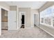 Bright bedroom features a large window, neutral carpet, and attached bath at 4936 Crab Pond Ct. # 201, Myrtle Beach, SC 29579