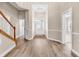 Bright foyer features beautiful wood flooring and a welcoming entryway at 4936 Crab Pond Ct. # 201, Myrtle Beach, SC 29579
