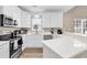 Beautiful kitchen featuring stainless steel appliances, white cabinetry and quartz countertops at 4936 Crab Pond Ct. # 201, Myrtle Beach, SC 29579