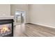 Bright living room featuring a fireplace, wood floors, and sliding glass doors leading to the patio at 4936 Crab Pond Ct. # 201, Myrtle Beach, SC 29579
