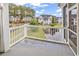 Secluded patio with calming views of manicured lawns and neighborhood ponds at 4936 Crab Pond Ct. # 201, Myrtle Beach, SC 29579