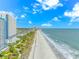 Aerial view of the ocean, beach, and surrounding town on a bright, sunny day at 504 N Ocean Blvd. # 310, Myrtle Beach, SC 29577