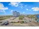 Beautiful sunny day, ocean view, and building exterior showcases the property's ideal location at 504 N Ocean Blvd. # 310, Myrtle Beach, SC 29577