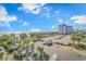 Scenic view of the beach and nearby parking, surrounded by lush palm trees on a bright sunny day at 504 N Ocean Blvd. # 310, Myrtle Beach, SC 29577