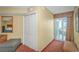 Well-lit hallway with closet space, a mirror, seating, and access to a private balcony at 504 N Ocean Blvd. # 310, Myrtle Beach, SC 29577