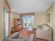Comfortable living room with natural light, balcony access, a television, and inviting seating at 504 N Ocean Blvd. # 310, Myrtle Beach, SC 29577