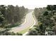 Scenic street view lined with lush trees, landscaped medians, and sidewalks; new construction community at 523 Oak Landing Dr., Myrtle Beach, SC 29588