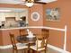Charming dining area adjacent to kitchen with seating for four at 5511 N Ocean Blvd. # 202, Myrtle Beach, SC 29577