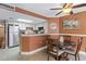 Open concept dining area with kitchen, seating for four, and appealing decor at 5511 N Ocean Blvd. # 202, Myrtle Beach, SC 29577