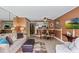 Comfortable living room with dining area, kitchen and large couch at 5511 N Ocean Blvd. # 202, Myrtle Beach, SC 29577