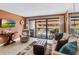 Inviting living room with sliding glass doors to balcony and comfortable seating at 5511 N Ocean Blvd. # 202, Myrtle Beach, SC 29577