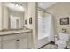 Bright bathroom featuring a single sink vanity with granite countertops, a tub, and toilet at 556 Timber Creek Dr., Loris, SC 29569